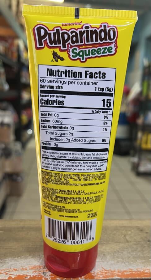 De La Rosa Pulparindo Squeeze Tamarindo Paste nutritional label on a bright yellow tube, highlighting calories and serving size.