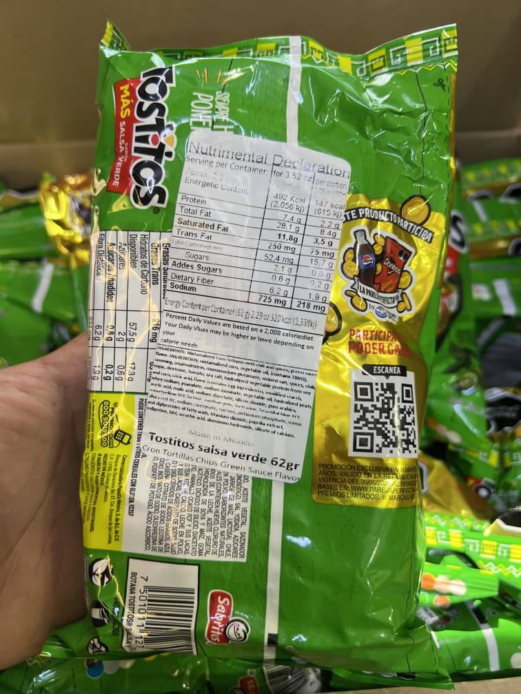 Nutritional information label on Tostitos Salsa Verde 62g chip bag, showcasing bold flavor and snack details.